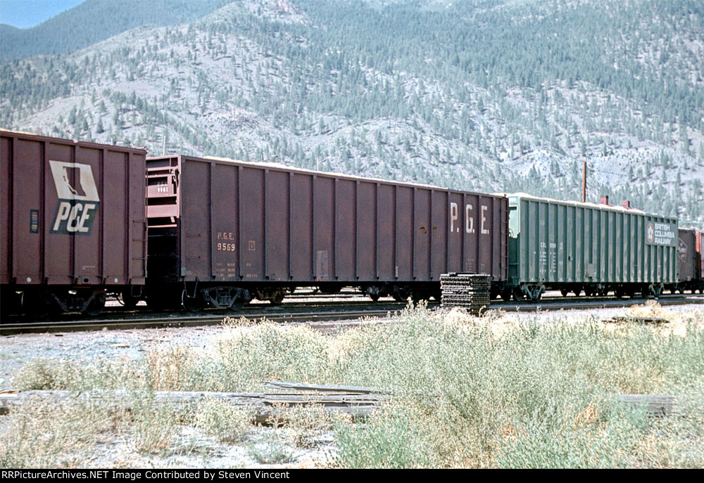 Pacific Great Eastern woodcip gon #9569 flanked by BCOL 90199 (right) & PGE 60047 (left).